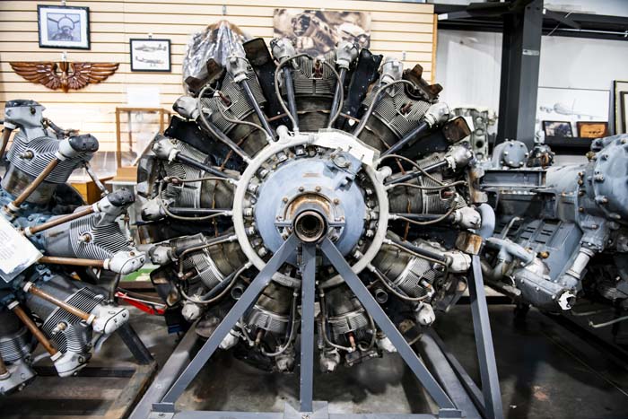 Visitors exploring vintage aviation equipment displays