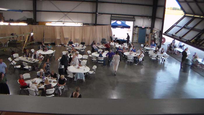 Veterans standing for recognition at the hangar dance