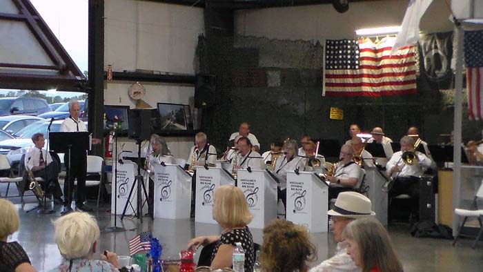 Event setup with tables and decorations at the hangar dance