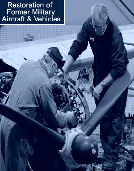 Squadron volunteers working on the restoration of the A-26 in the hangar